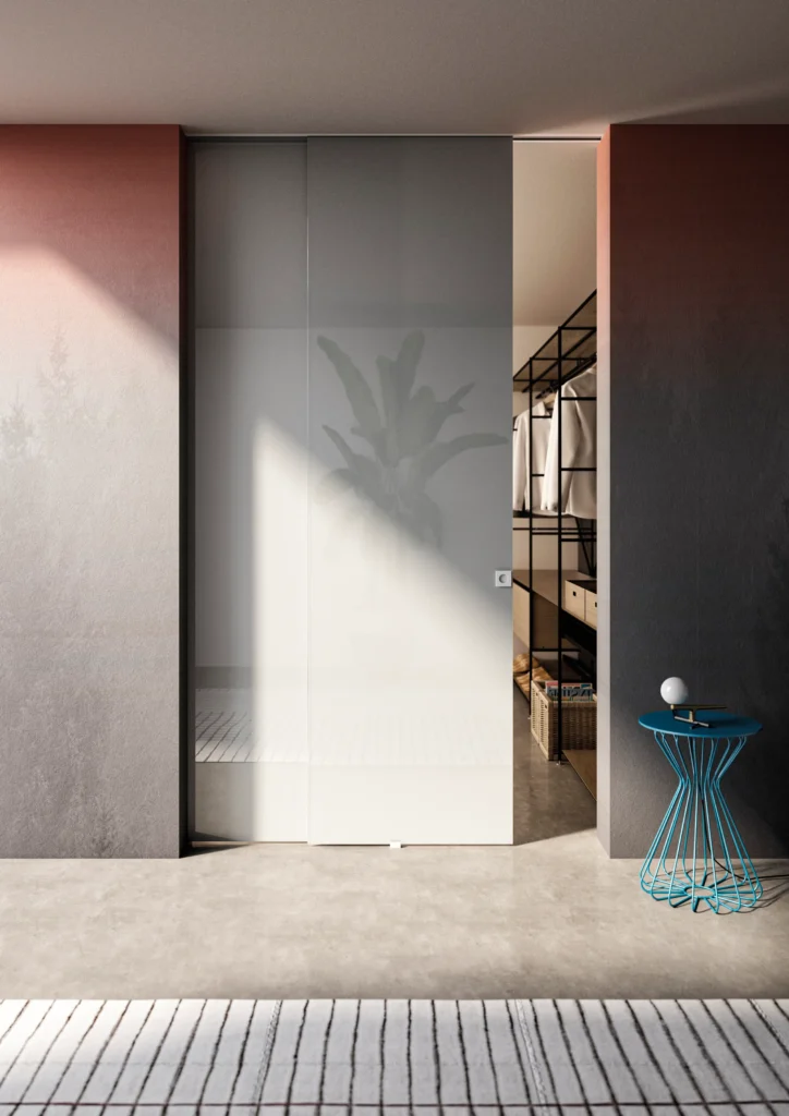 Porta Cristal scorrevole esterno muro con vetro laccato bianco